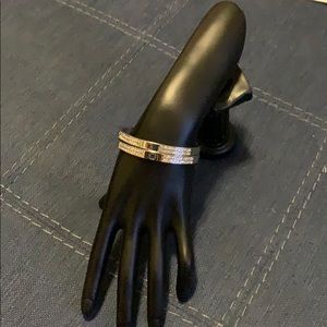 Two Silver bracelets with rhinestones.